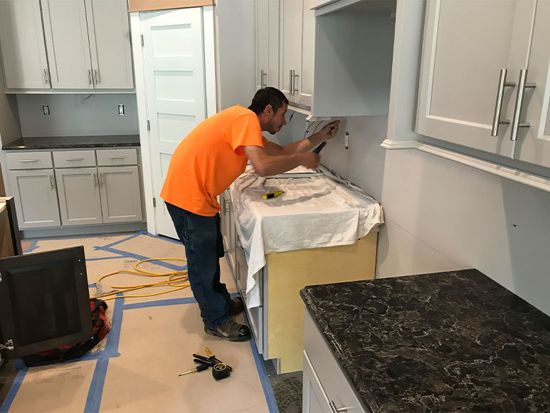 Mark installing under cabinet lighting