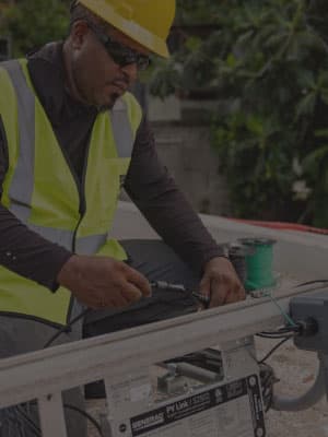 repair man working on generator