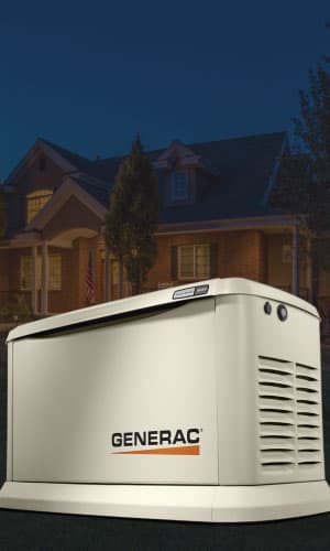 standby generator in front of home at night
